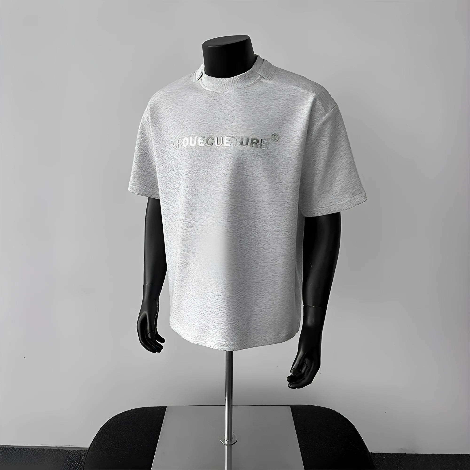 Men's white short sleeve cotton t-shirt with printed letters showing loose fit pullover style