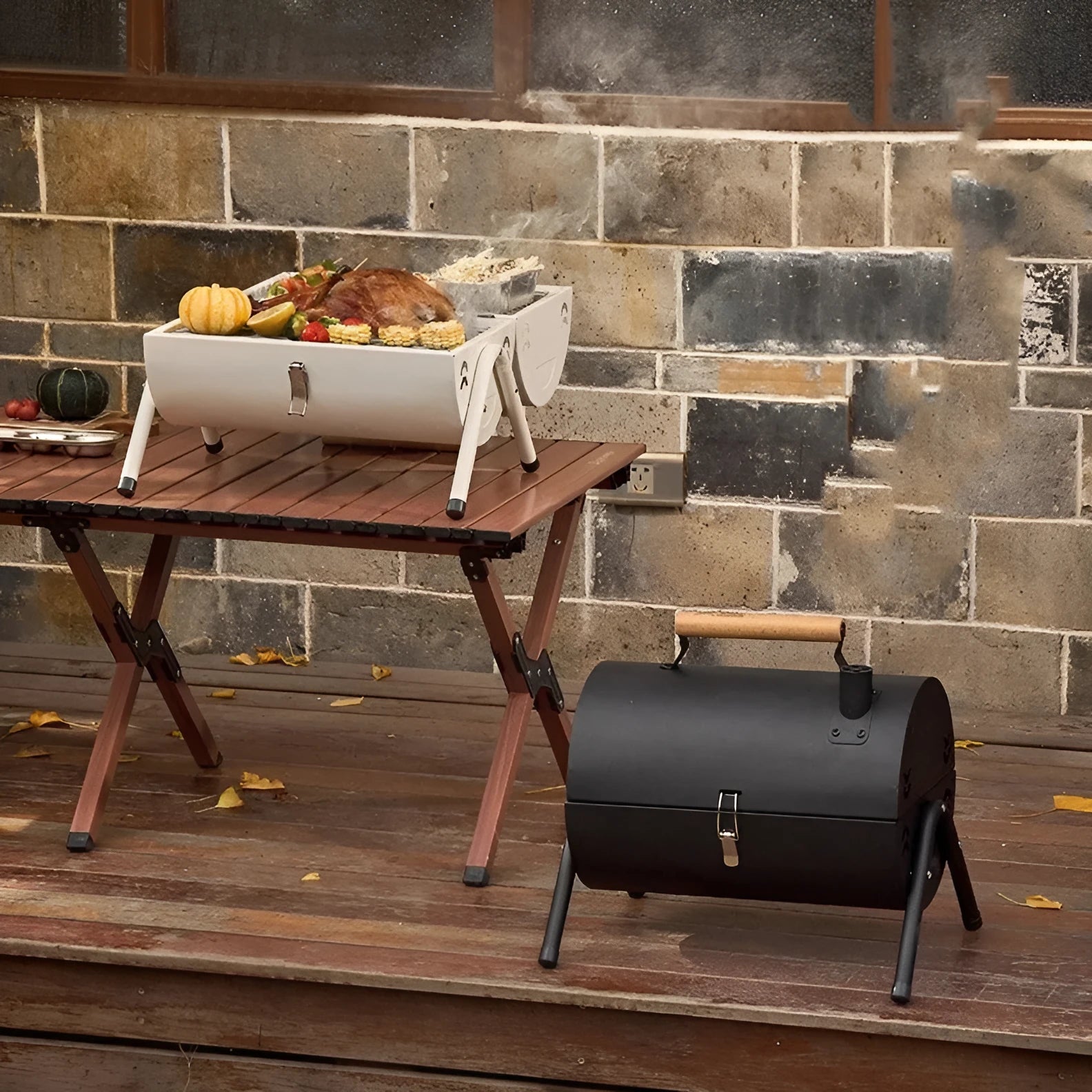 White round portable charcoal grill with chimney oven, grill mesh, and carbon tanks for outdoor cooking.