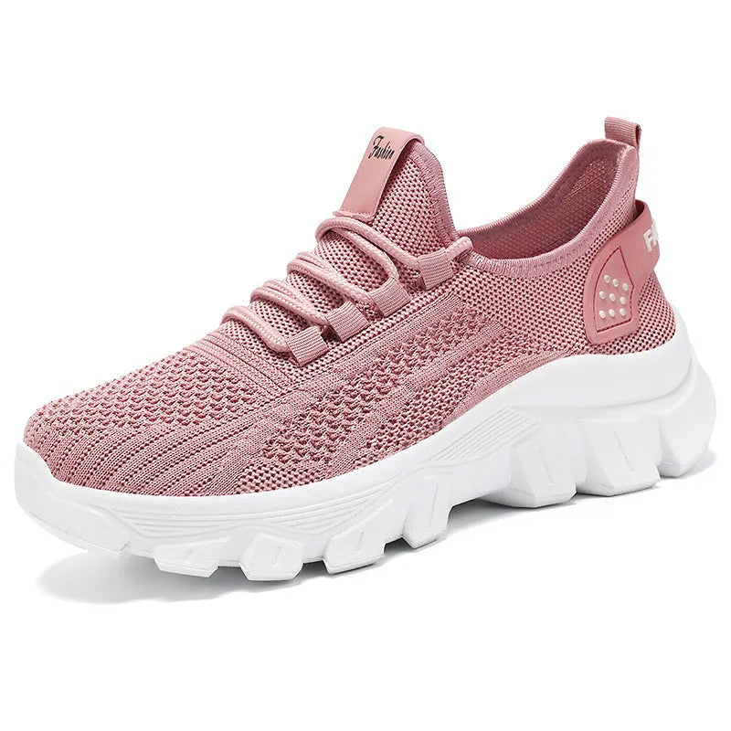 Women's white Flyknit sneaker with thick PVC sole and round toe lace-up design