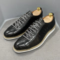 Men's low-top shoes with a handmade embossed pattern on the upper and front lace closure.
