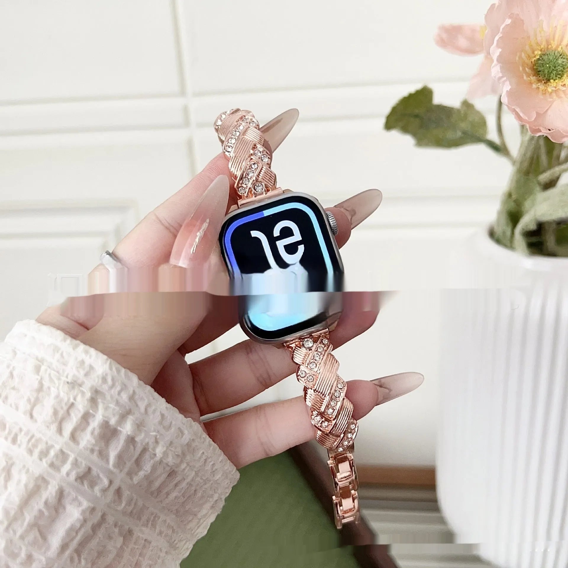 Personalised twist diamond design metal watch strap for Apple Watch in rose gold colour.