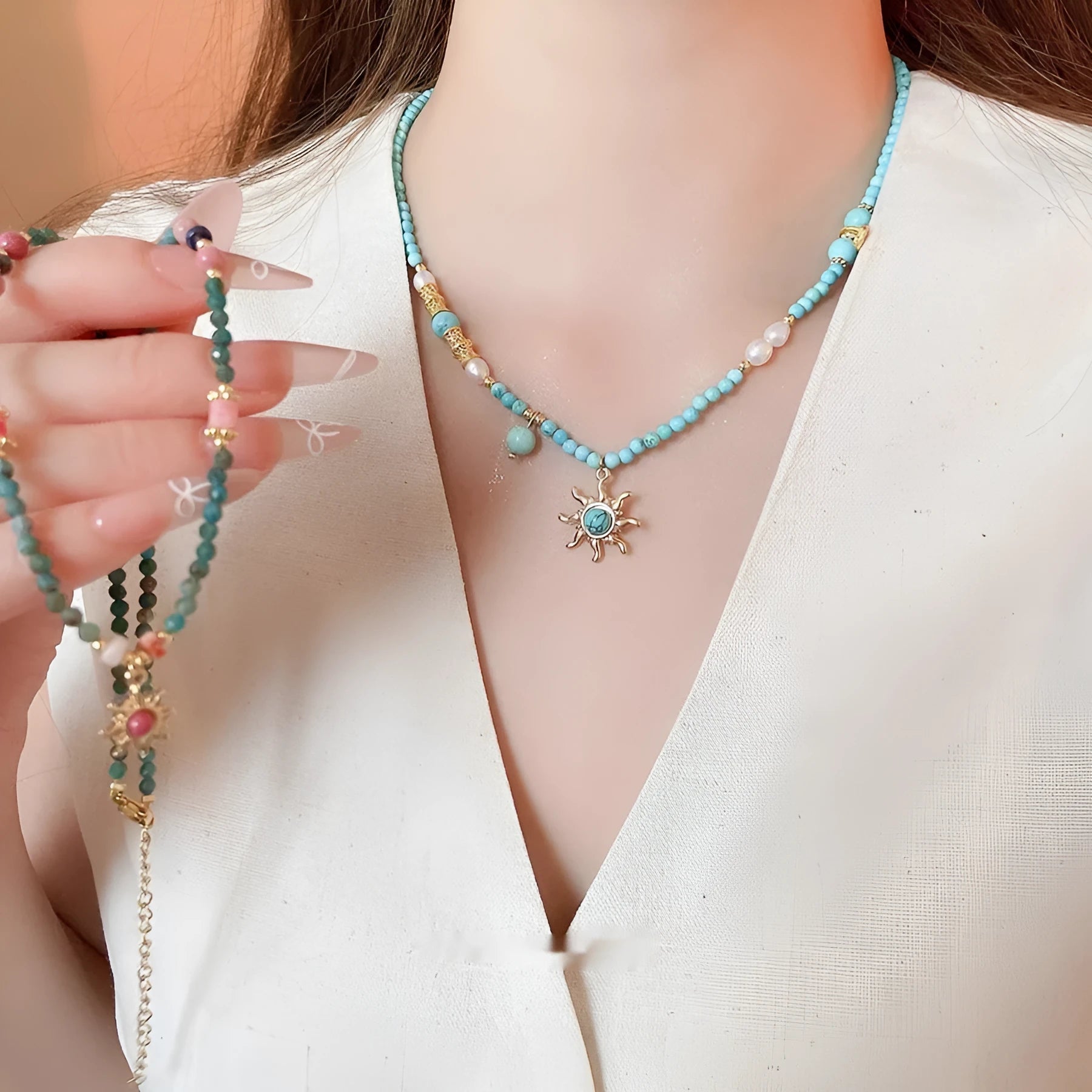French royal style necklace with sun pendant, freshwater pearls, and adjustable metal chain.