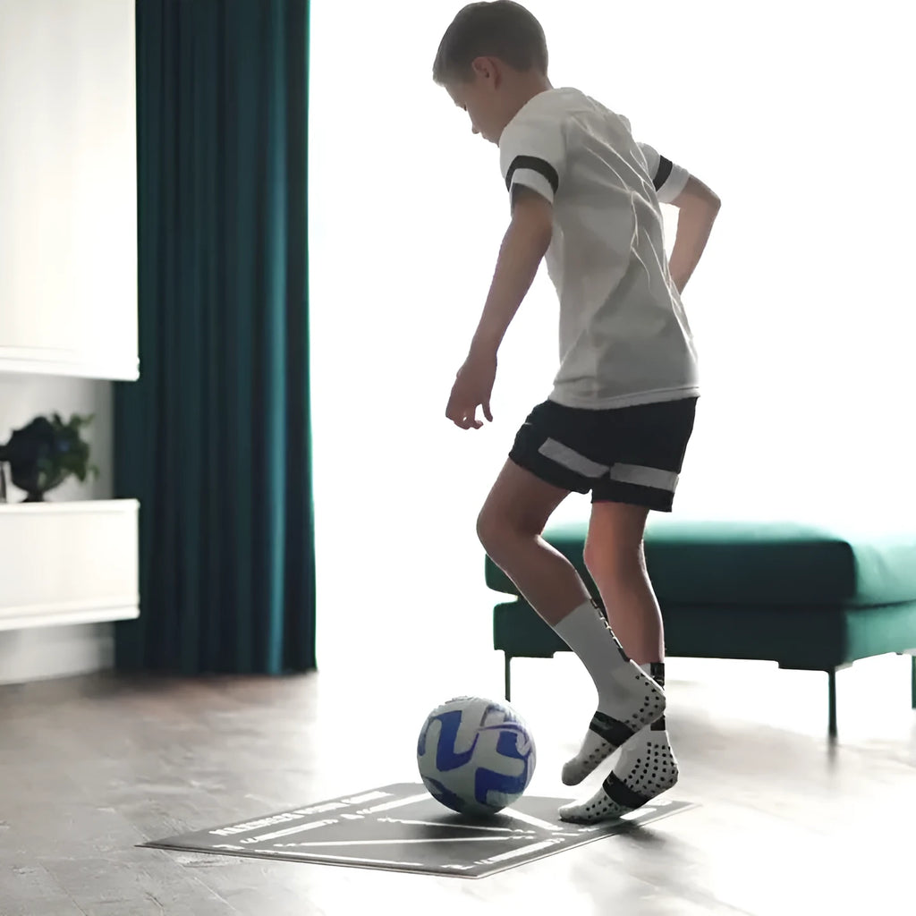 Black 60x90cm non-slip football training mat on grass