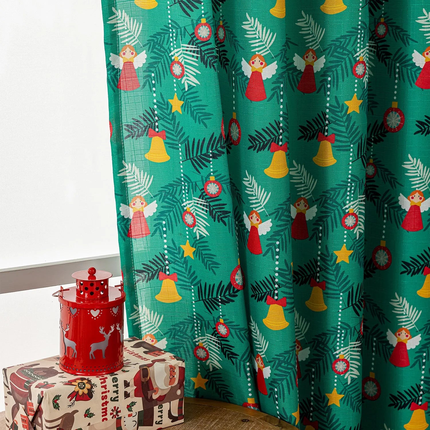 Green Christmas curtain with printed snowman and angel cartoon figures for window decoration