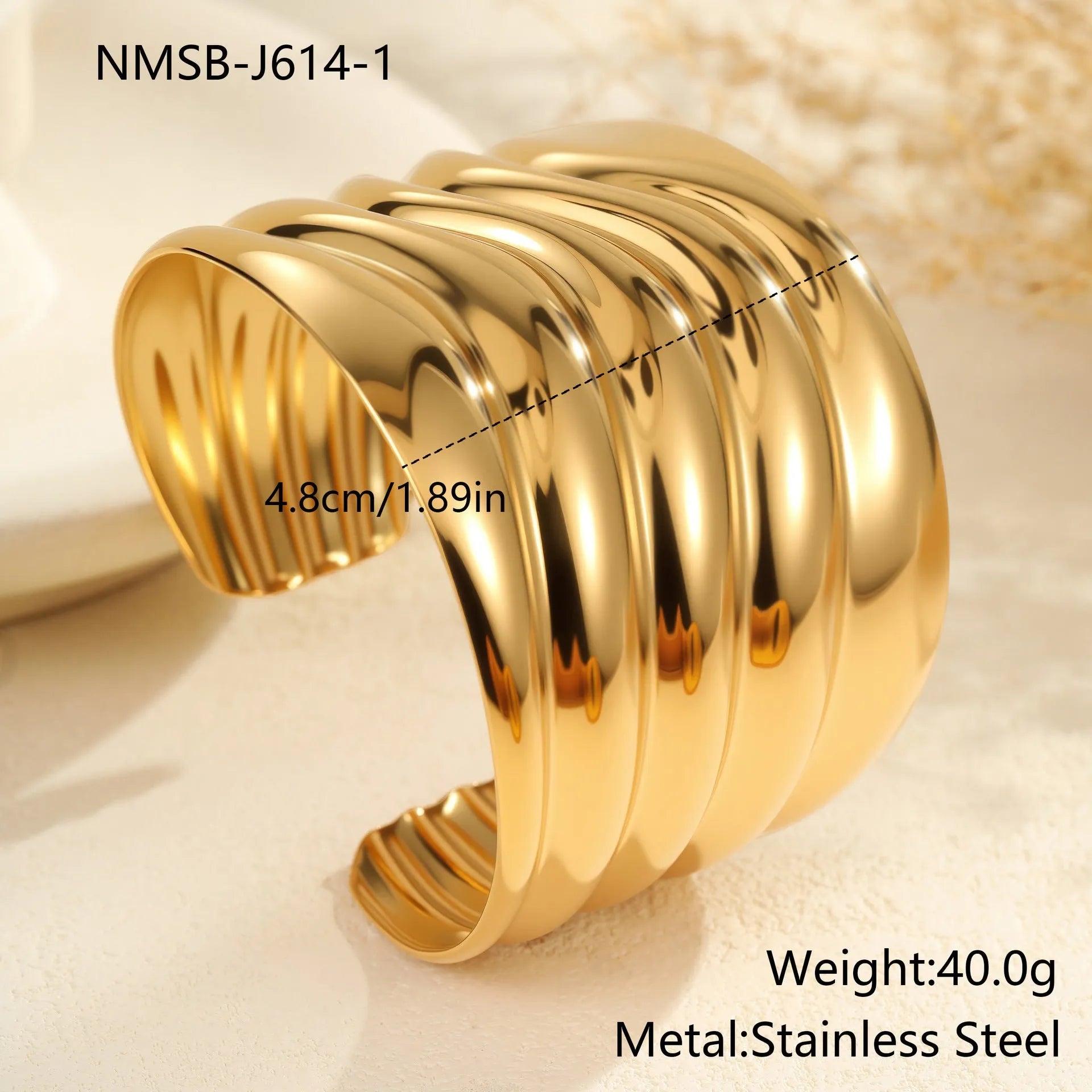 Women's gold plated stainless steel bracelet with exaggerated wide geometric wave design and niche opening