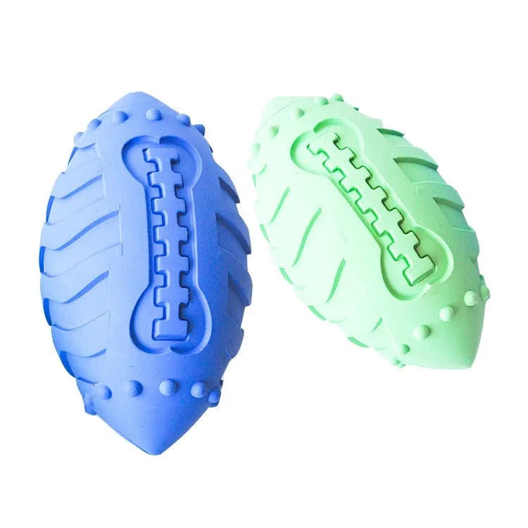 Bite-resistant rubber dog training ball in rugby shape, light green colour, for aggressive chewers