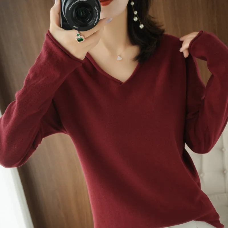 Women's long sleeve V-neck knitwear pullover top in a choice of ten colours on a hanger.