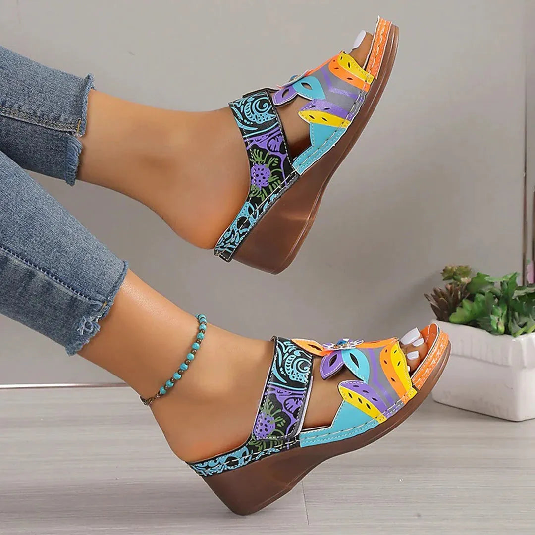 Ethnic Cool Girl coloured slope and totem design sandals with cowhide upper and rubber sole.