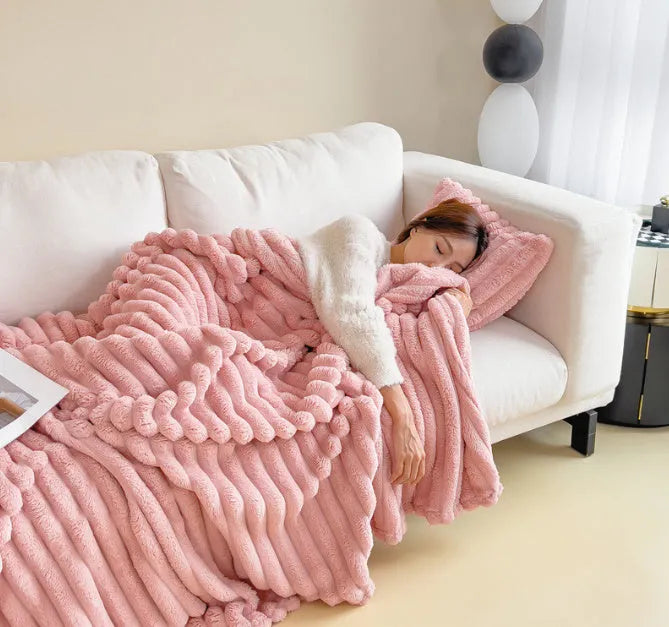 Soft Wind double-sided thickening bubble velvet blanket in a solid colour shown on a sofa.