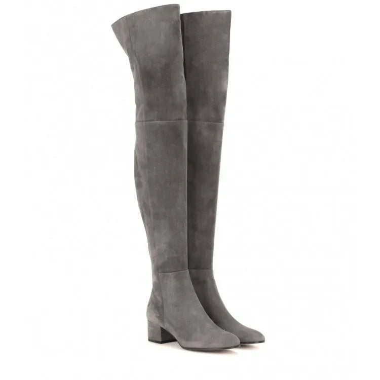 Women's grey suede over-the-knee flat boots with a pointed toe and thick low heel.