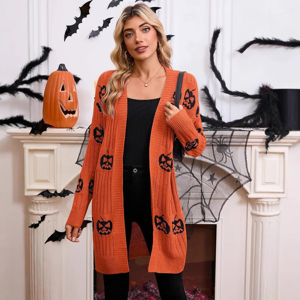 Women's black knitted cardigan with an orange pumpkin head jacquard pattern and regular sleeves.