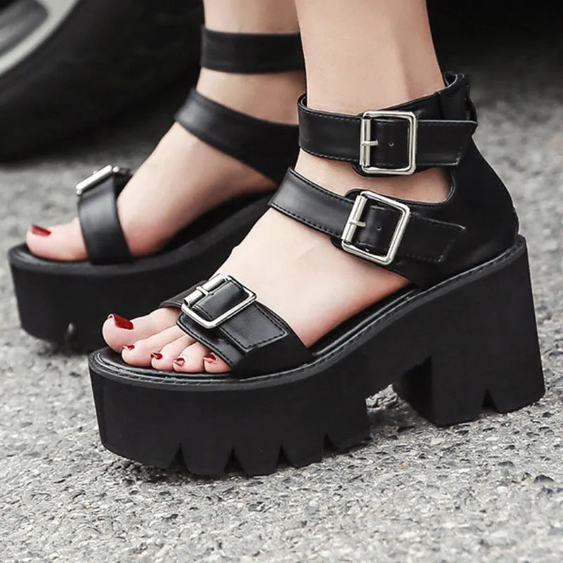 Black women's chunky heel sandals with back zipper, thick sole, buckle detail and round toe in punk Harajuku style.