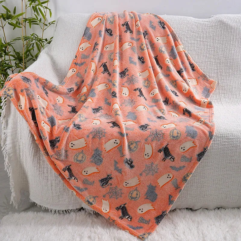 Cartoon print flannel blanket for children shown in two sizes.