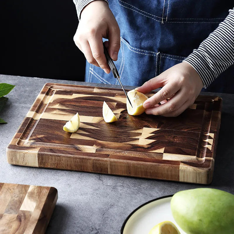 Brown imported acacia solid wood cutting board with 3cm thickness on kitchen counter