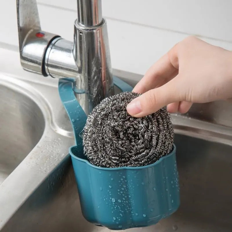 Dark blue Nordic style plastic drain basket next to a kitchen sink