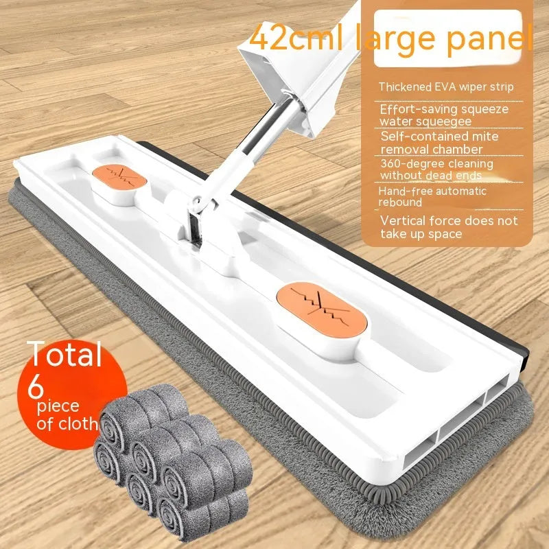 Large flat mop with long stainless steel handle and blue cleaning cloth on a hard floor.