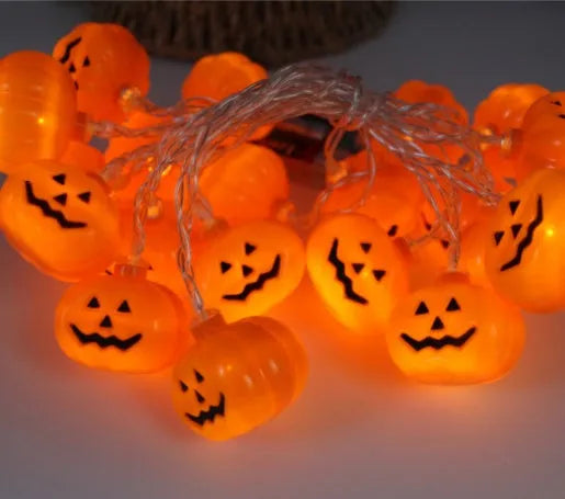 Halloween LED string lights with pumpkin, ghost, and bat pendants in multi-colour light mode