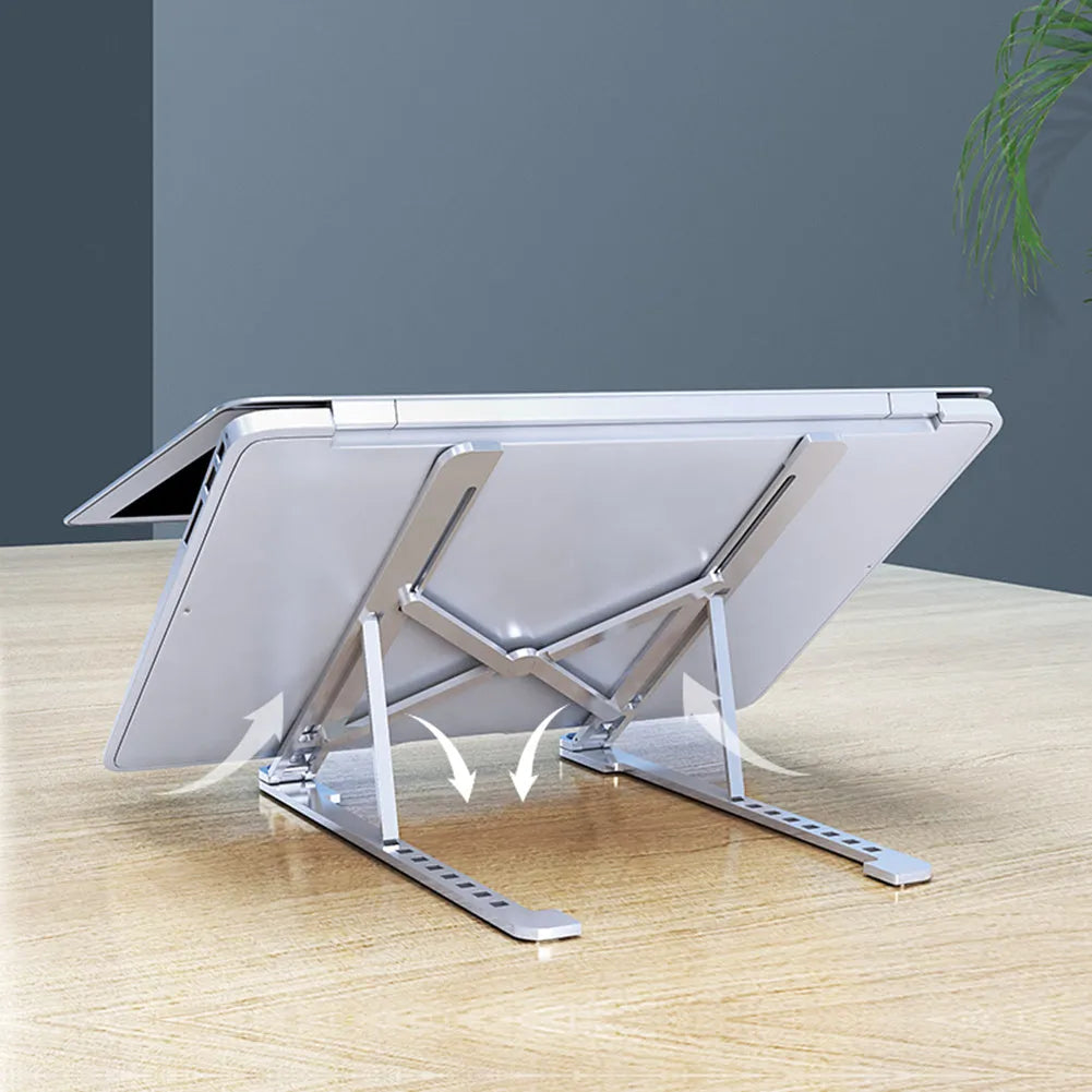 Foldable aluminium laptop stand in silver, shown open in use and closed for storage.