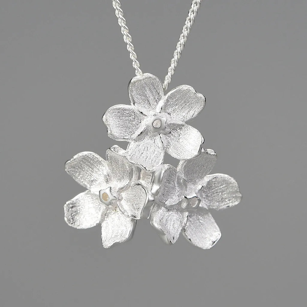 Sterling silver Myosotis sylvatica floral pendant in pastoral open mouth design without chain