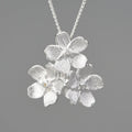 Sterling silver Myosotis sylvatica floral pendant in pastoral open mouth design without chain