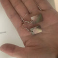A pair of geometric-shaped women's earrings made from natural shell in a retro style.