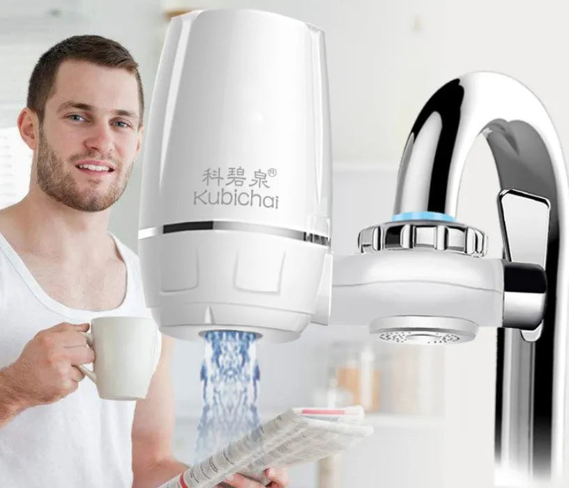 White plastic faucet-mounted water filter with ceramic cartridge and tap adapters