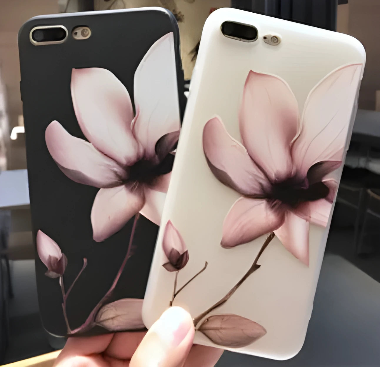 Embossed single flower design on black TPU iPhone case showing back cover protection