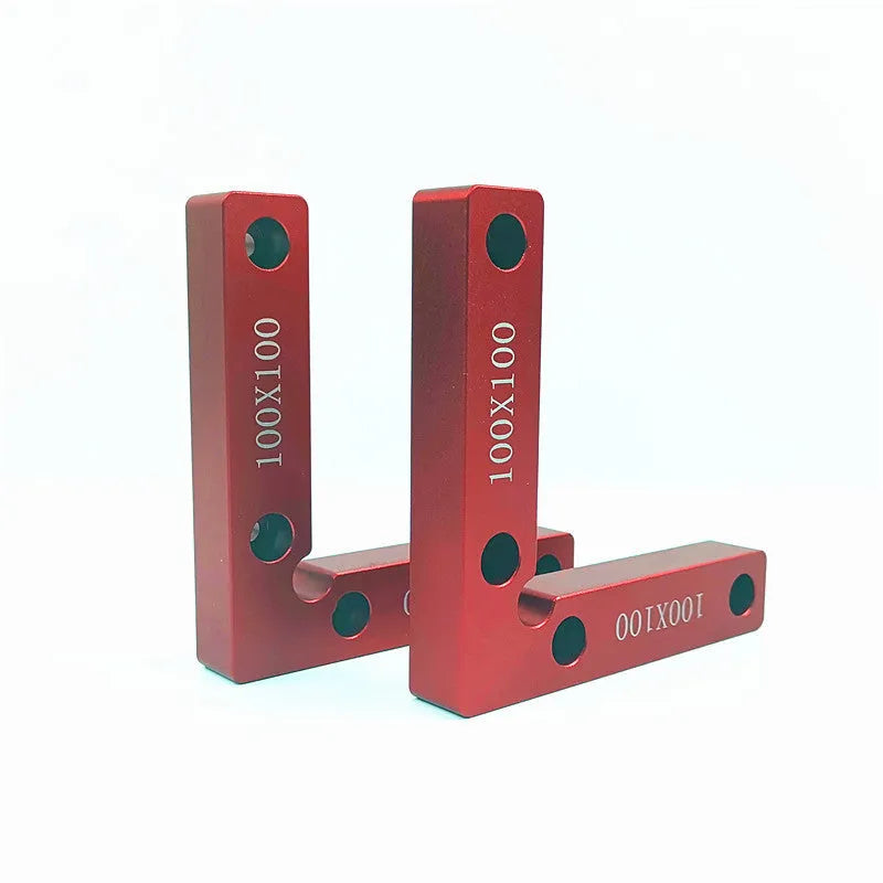 Aluminum alloy woodworking right angle positioning block on a workbench.