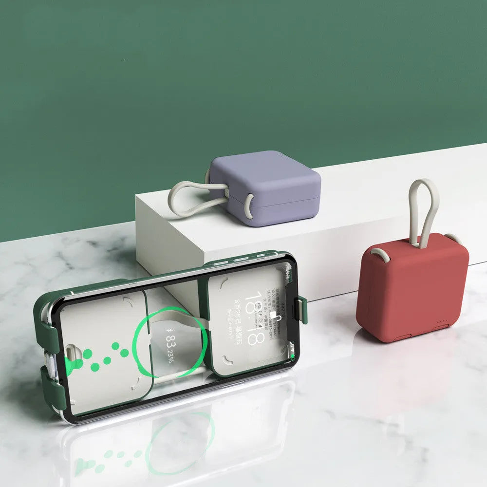 Handbag clip power bank in blue showing phone stand function with charging ports visible