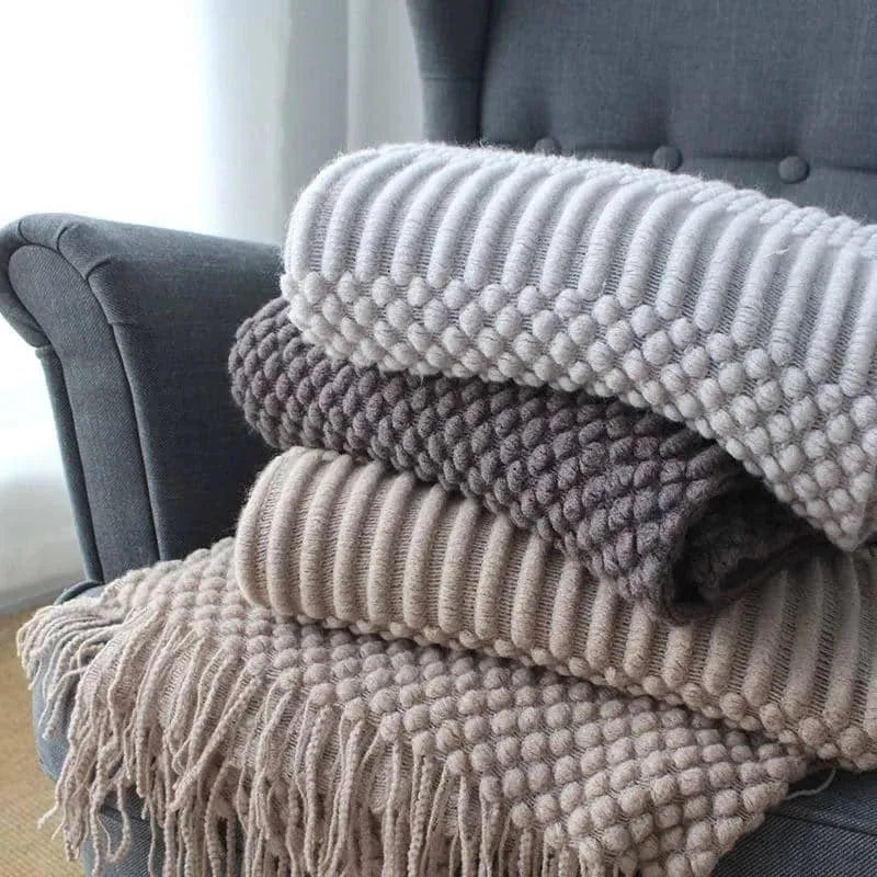 Small polyester fibre nap blanket measuring 127cm by 170cm in dark grey colour