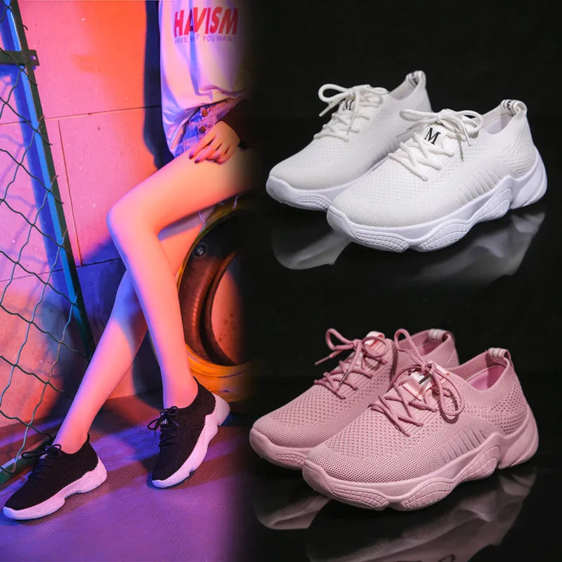 Women's white thick-soled casual sports shoes with woven upper and front strap.
