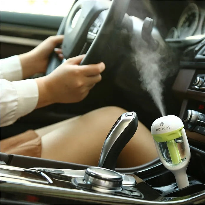 Compact blue car humidifier with 180-degree rotation for vehicle air freshening and humidification