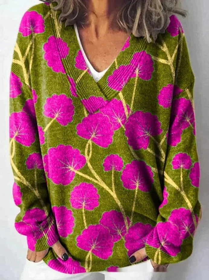 Women's white floral print V-neck sweatshirt with 3D pattern and long sleeves on a hanger.