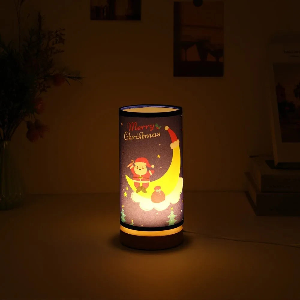 Moon Santa Claus themed LED night light with a bamboo base and a USB plug cable.