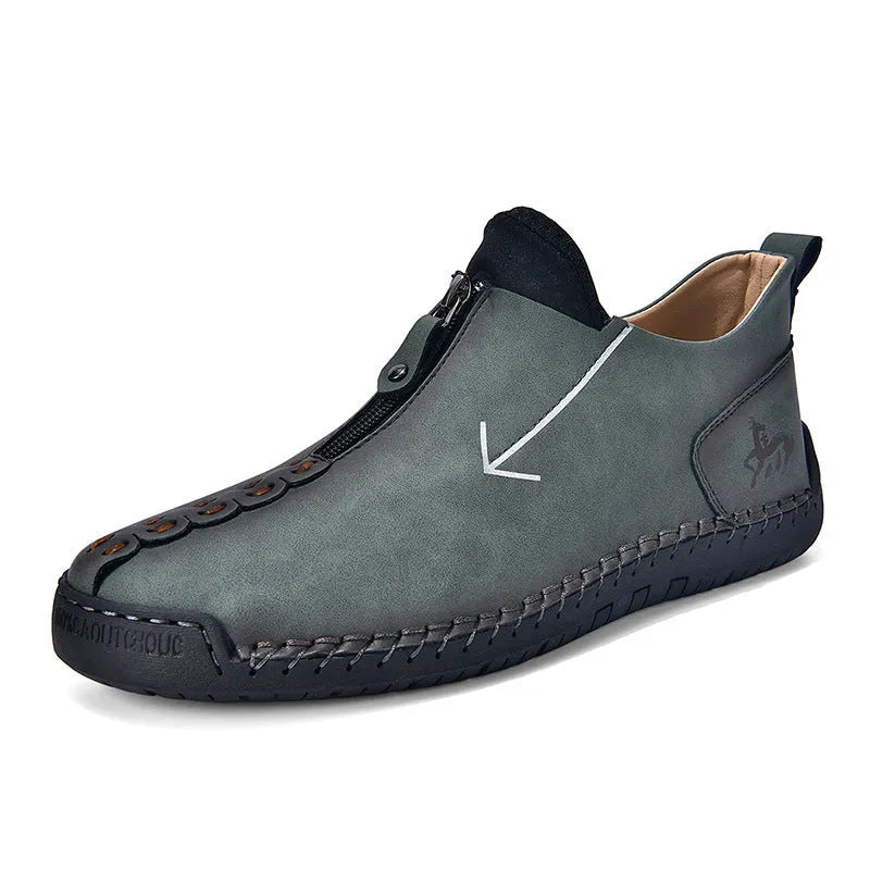 Men's black casual ankle boots with a front zip closure and visible stitching detail