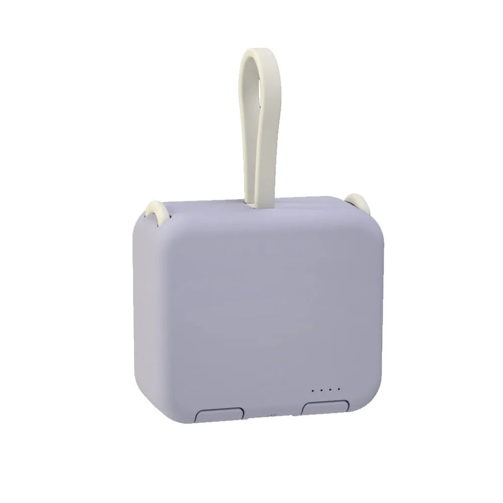 Handbag clip power bank in blue showing phone stand function with charging ports visible