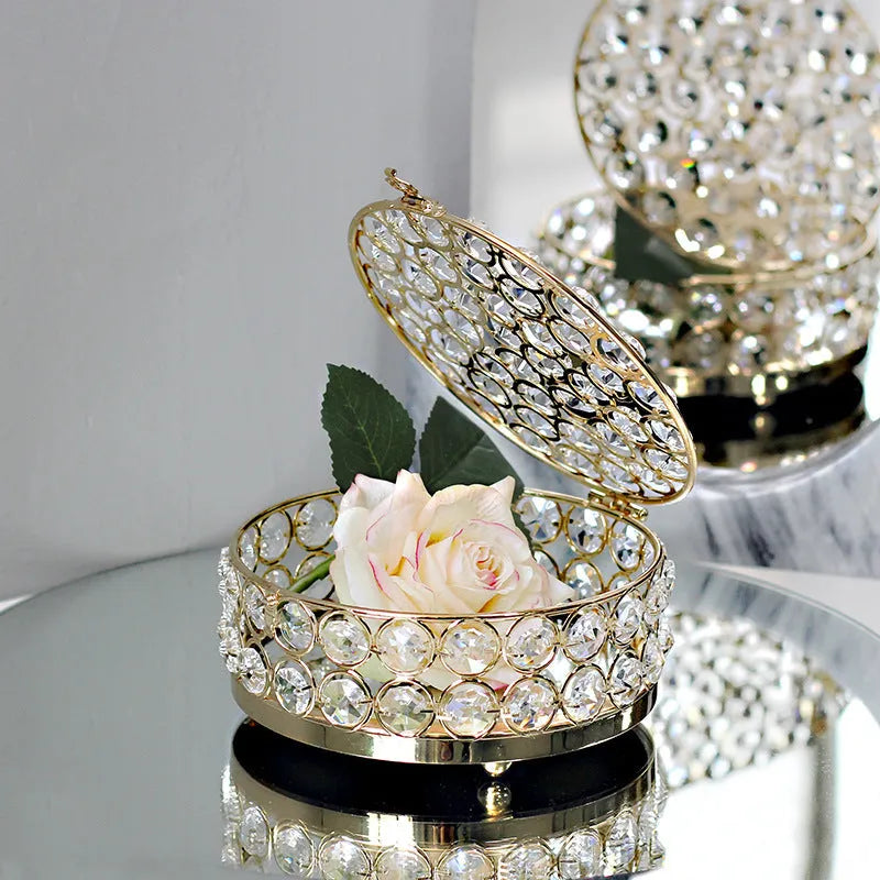 French gold metal jewellery box with a transparent crystal glass lid for storing rings and necklaces.