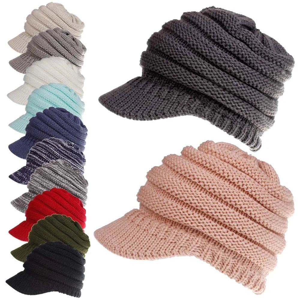 Women's acrylic knitted ponytail beanie hat in beige colour on a model.