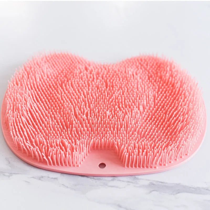 Orange silicone bristle bath brush with suction cups on base, size 23x30cm, for foot and back cleaning.