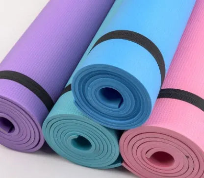 Red EVA yoga mat with textured anti-skid surface, shown rolled and unrolled.
