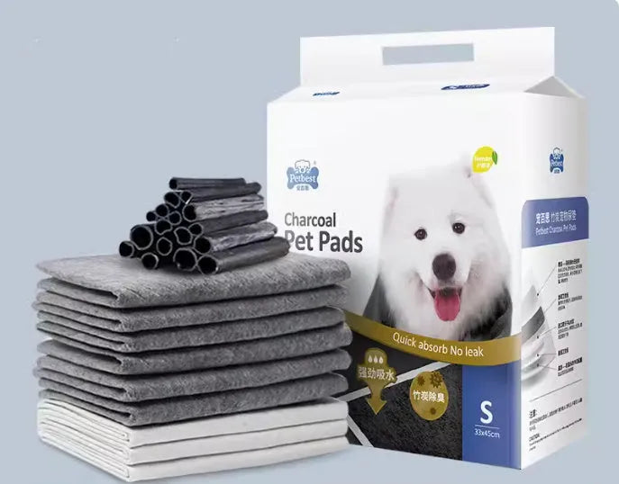 Pack of thickened dog urine pads showing size comparison between S, M, L and XL options
