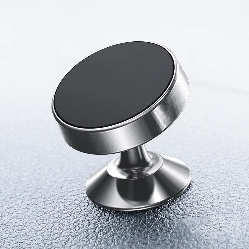 Magnetic car phone holder with aluminium alloy cradle shown in black, mounted on a car air vent.