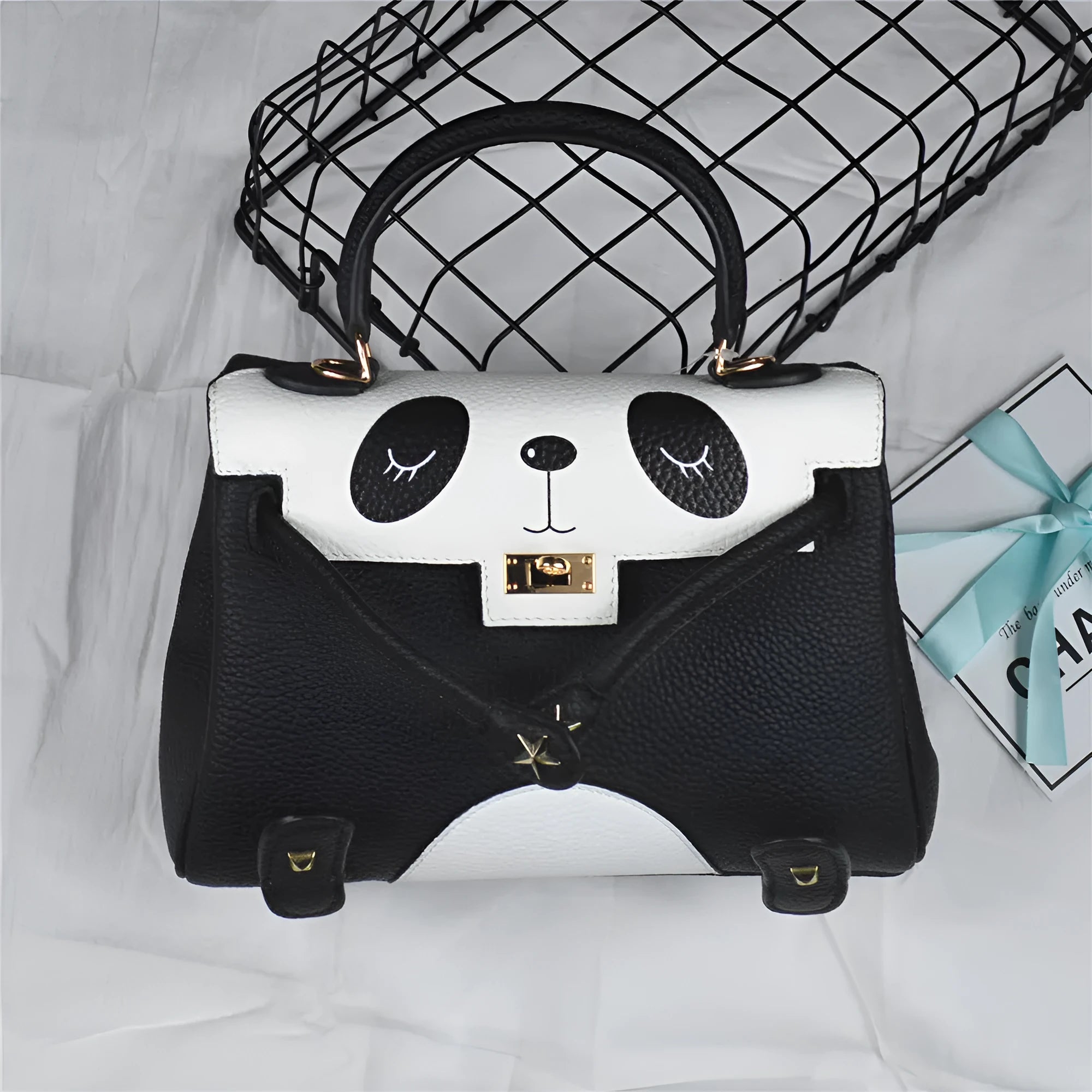 Ladies panda handbag in cow leather with animal print pattern available in two sizes