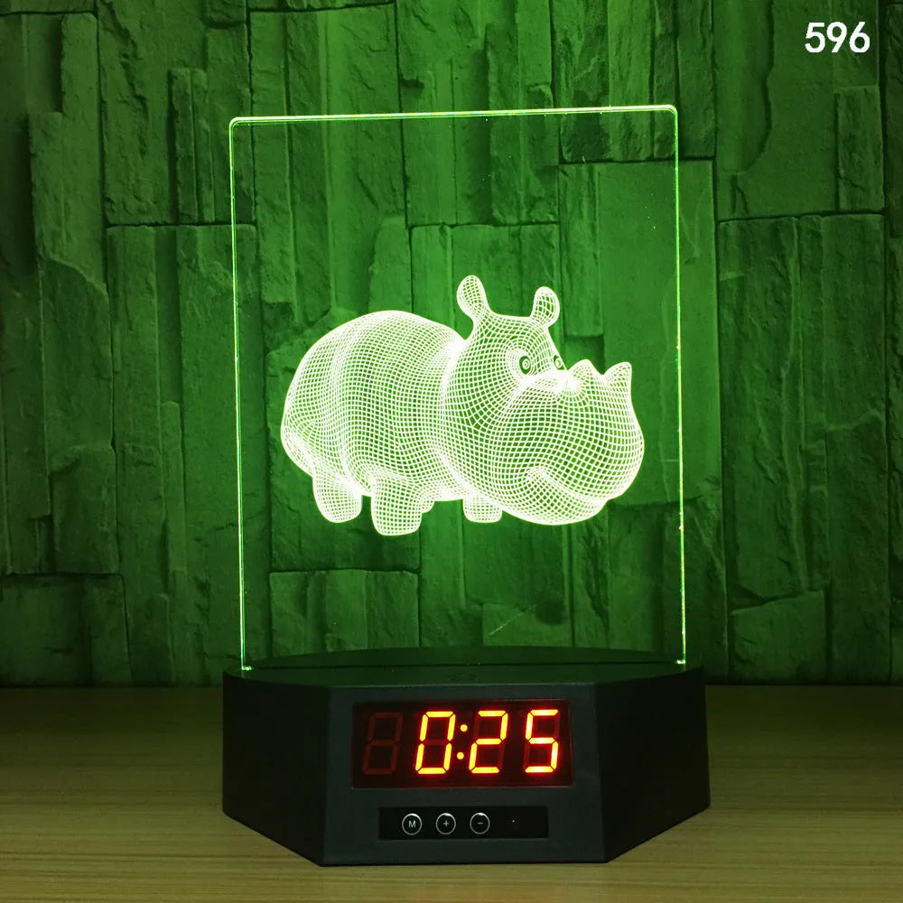 Glowing blue dolphin 3D night light with wireless charging base and remote control on wooden table
