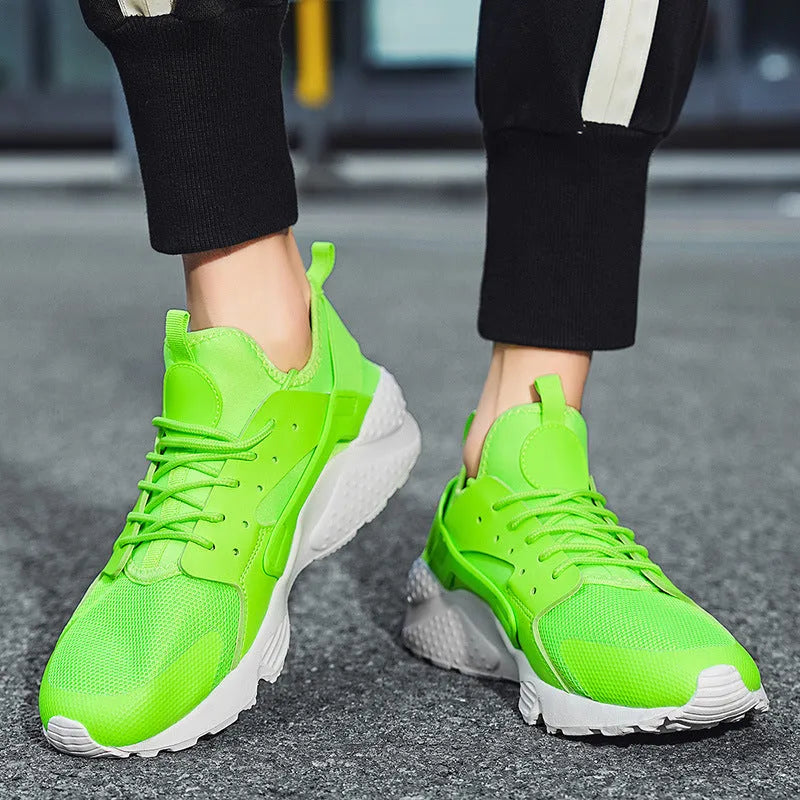 Men's green low top mesh casual shoes with lace-up front and cross shoulder straps on a flat MD sole