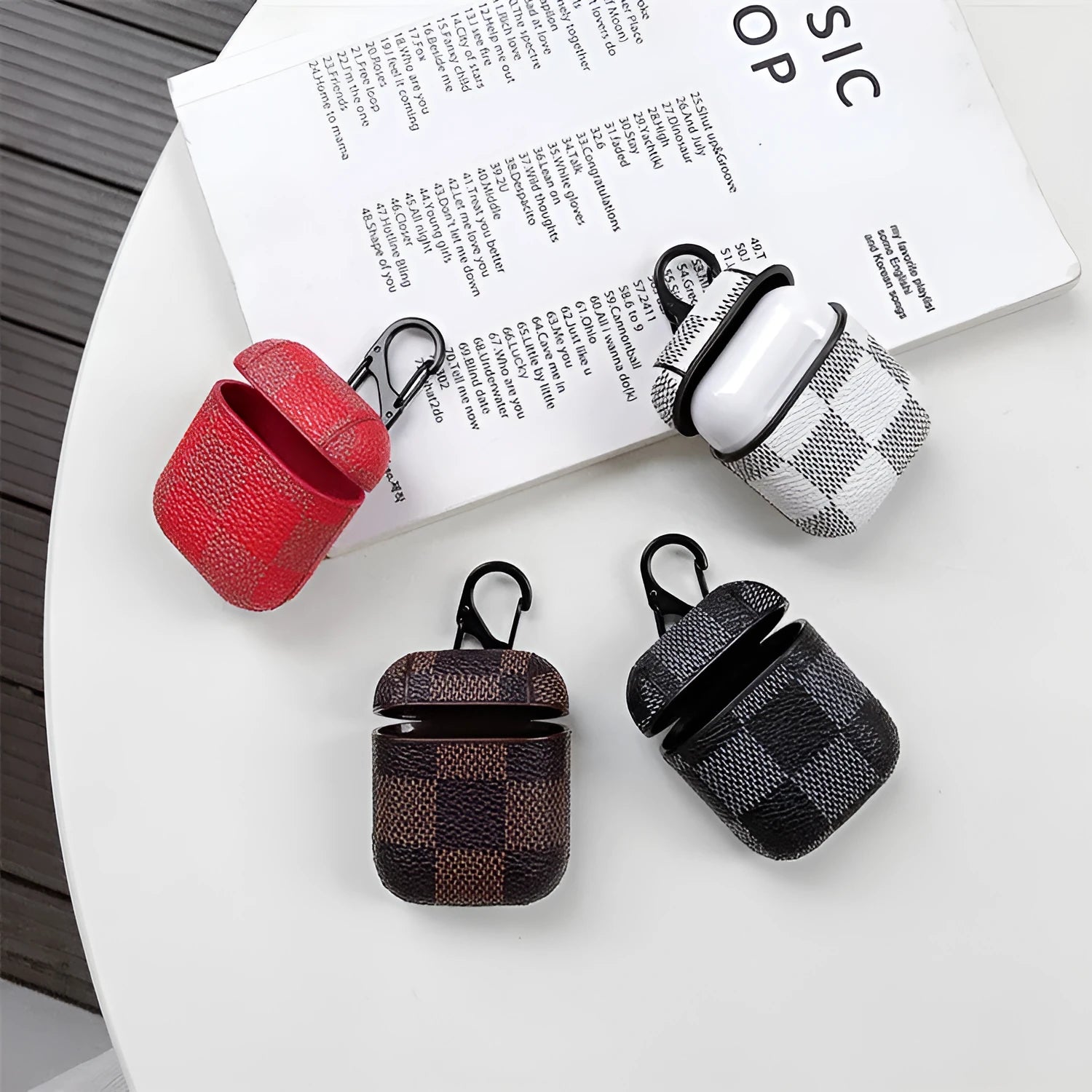 IPhone XS Max hard plastic case with grid pattern and anti-lost hook, next to a compatible AirPods 2 leather charging case.
