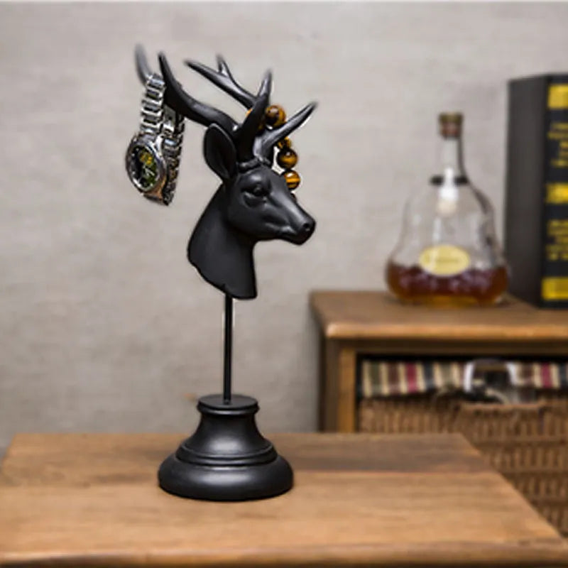 A solid natural resin animal sculpture for home decoration in black, white, or wood colour.