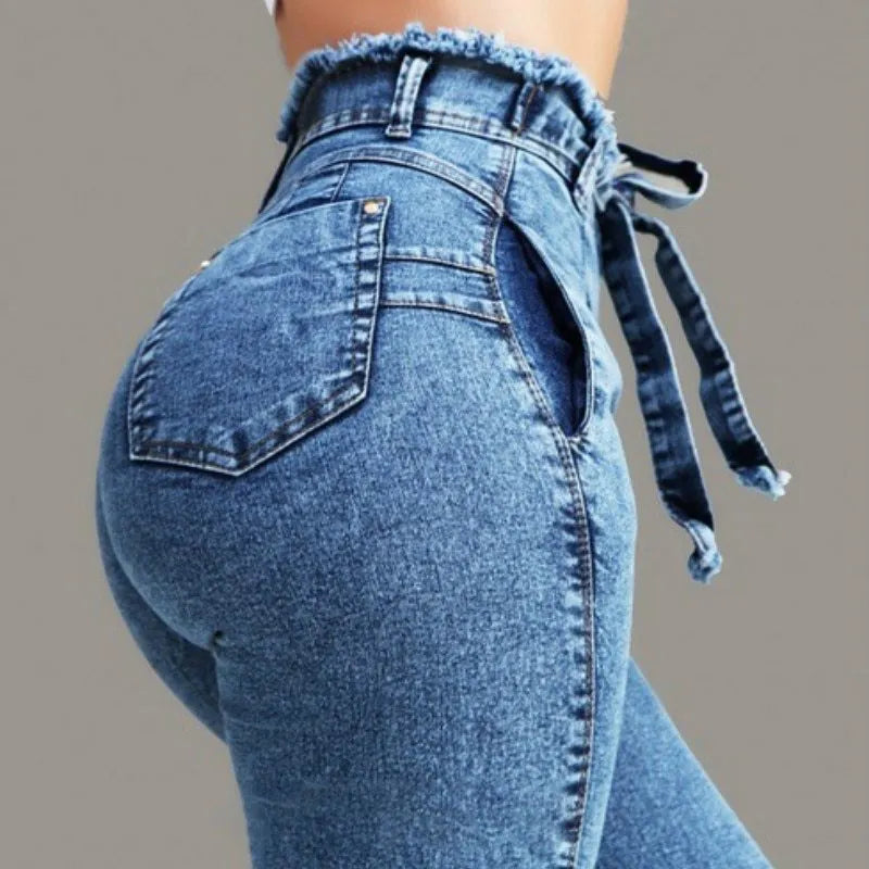 Fringed jeans in cowboy fabric showing decorative fringe trim along hem in available colours