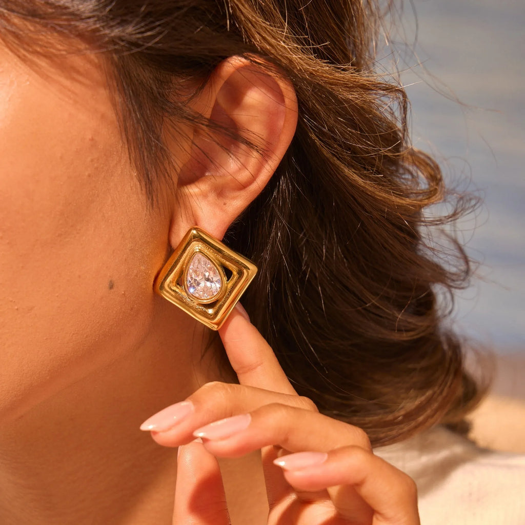 Gold stud earrings with geometric water drop zircon design on stainless steel