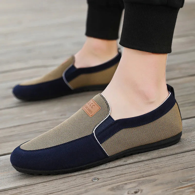 Men's grey and khaki canvas casual shoes with a round toe and rubber sole.
